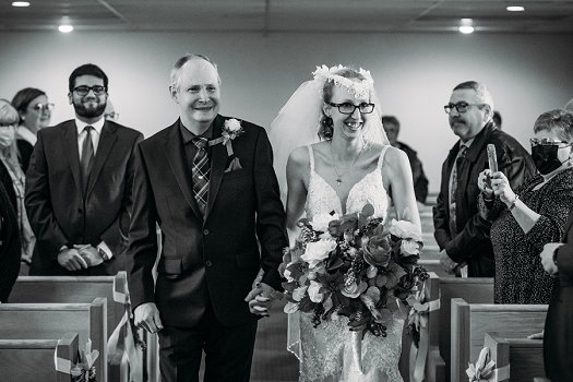 bride and dad walking down isle